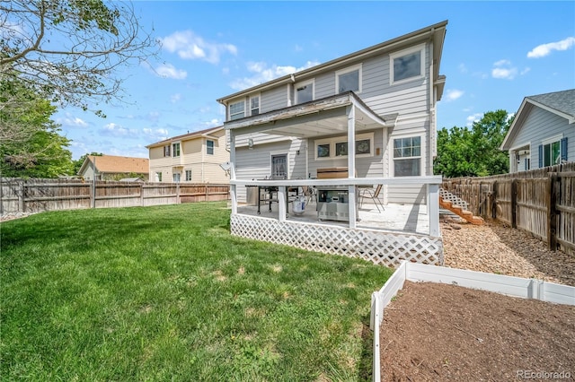 13152 E 104th Dr, Commerce City, CO 80022 - back of property featuring a deck and a fenced backyard