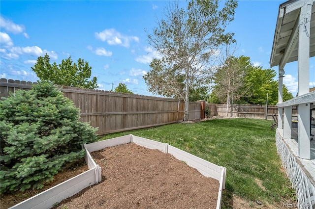 13152 E 104th Dr, Commerce City, CO 80022 - fenced backyard featuring a vegetable garden