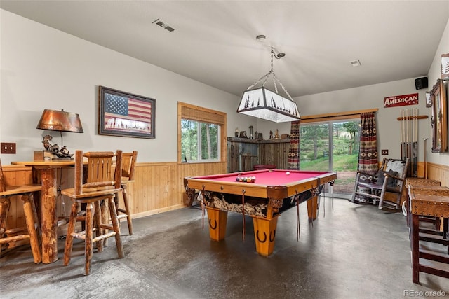 15608 Ouray Rd, Pine, CO 80470 - playroom with billiards, finished concrete flooring, healthy amount of natural light, a wainscoted wall, and wooden walls