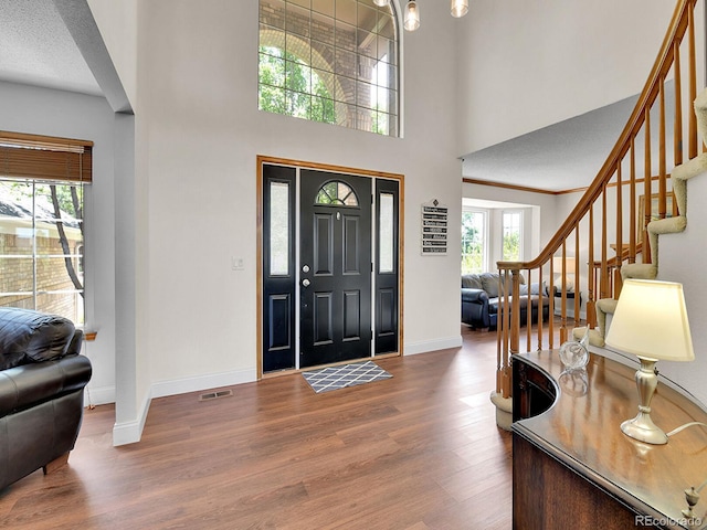 2145 Wynterbrook Dr, Highlands Ranch, CO 80126 - foyer with wood finished floors, stairs, and a high ceiling
