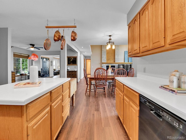 2145 Wynterbrook Dr, Highlands Ranch, CO 80126 - kitchen with black dishwasher, light wood-type flooring, light countertops, and ceiling fan