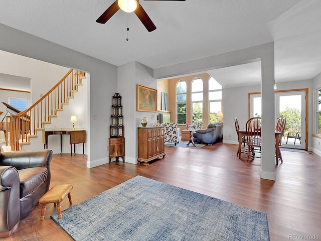 2145 Wynterbrook Dr, Highlands Ranch, CO 80126 - living area with a ceiling fan, dark wood finished floors, and stairway