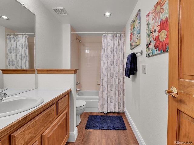2145 Wynterbrook Dr, Highlands Ranch, CO 80126 - bathroom featuring wood finished floors, vanity, shower / tub combo with curtain, and recessed lighting