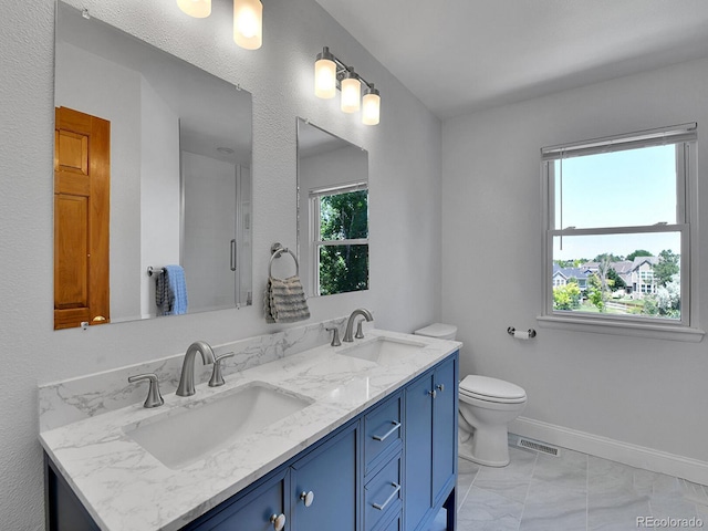 2145 Wynterbrook Dr, Highlands Ranch, CO 80126 - full bathroom with double vanity and marble look tile flooring