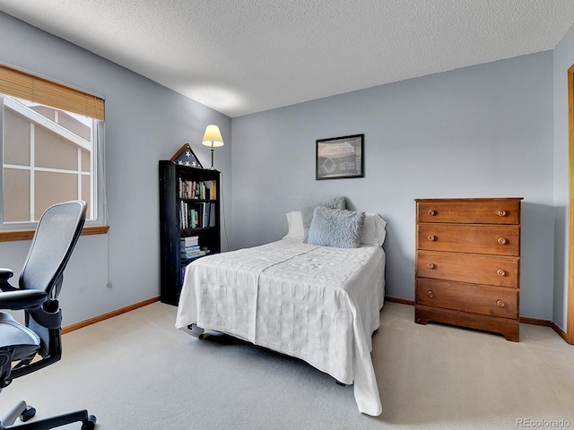 2145 Wynterbrook Dr, Highlands Ranch, CO 80126 - bedroom with light colored carpet and a textured ceiling