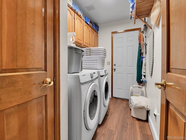 2145 Wynterbrook Dr, Highlands Ranch, CO 80126 - laundry room with cabinet space, washing machine and dryer, and dark wood-style floors