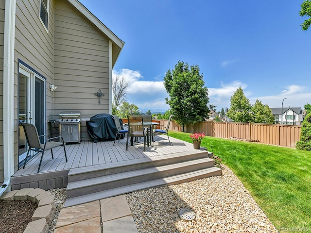 2145 Wynterbrook Dr, Highlands Ranch, CO 80126 - wooden terrace with area for grilling, a fenced backyard, and outdoor dining space
