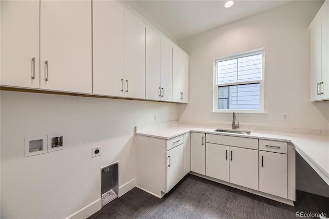 washroom with cabinets, washer hookup, electric dryer hookup, and sink