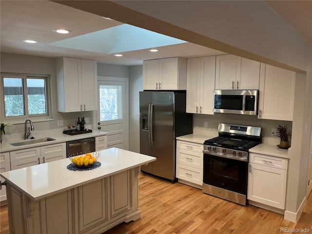 9705 W Dakota Ave, Lakewood, CO 80226 - kitchen with light countertops, stainless steel appliances, and a sink