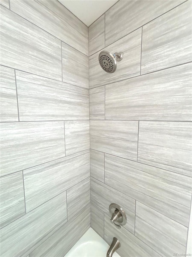 9705 W Dakota Ave, Lakewood, CO 80226 - bathroom featuring shower / tub combination