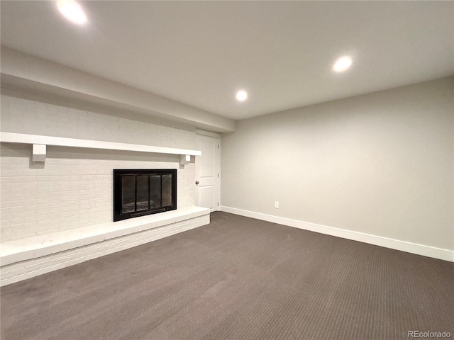 9705 W Dakota Ave, Lakewood, CO 80226 - unfurnished living room featuring dark carpet, baseboards, a brick fireplace, and recessed lighting