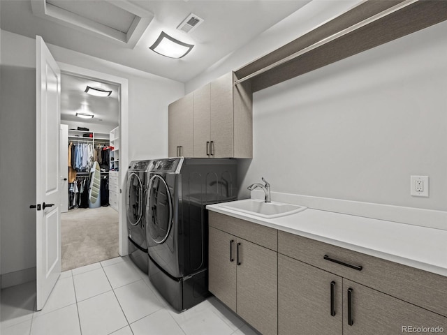 9487 Winding Hill Way, Lone Tree, CO 80124 - washroom featuring cabinet space, washing machine and clothes dryer, light carpet, attic access, and light tile patterned floors