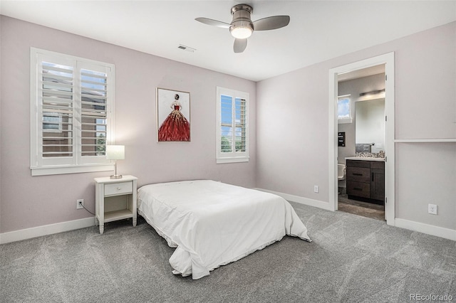 9487 Winding Hill Way, Lone Tree, CO 80124 - bedroom featuring carpet floors, baseboards, a ceiling fan, and connected bathroom