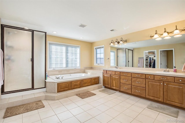 full bath featuring double vanity, visible vents, a garden tub, tile patterned flooring, and a shower stall