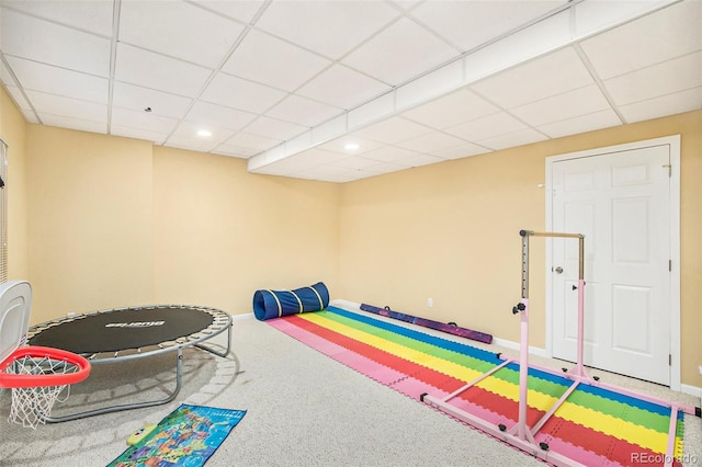 game room featuring a paneled ceiling, baseboards, and carpet flooring