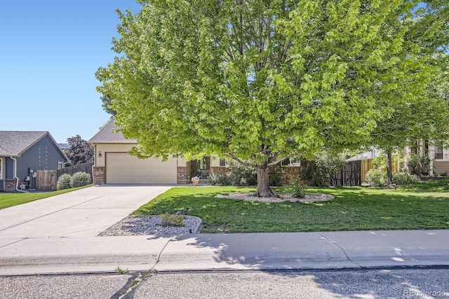 3143 50th Avenue Ct, Greeley, CO 80634 - view of property hidden behind natural elements featuring driveway, an attached garage, and brick siding