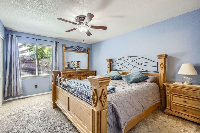 3143 50th Avenue Ct, Greeley, CO 80634 - bedroom featuring light carpet, a textured ceiling, and a ceiling fan