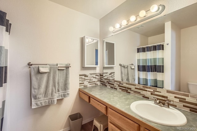 3143 50th Avenue Ct, Greeley, CO 80634 - full bathroom with decorative backsplash and vanity