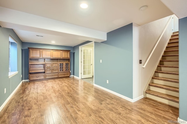 3143 50th Avenue Ct, Greeley, CO 80634 - below grade area with light wood-type flooring, stairs, and recessed lighting