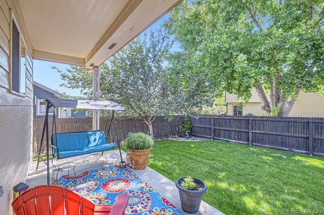 3143 50th Avenue Ct, Greeley, CO 80634 - fenced backyard with a patio