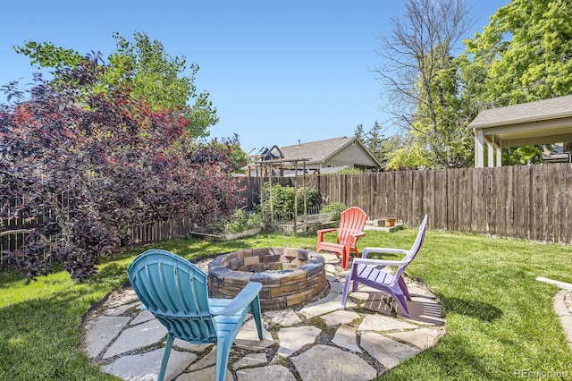 3143 50th Avenue Ct, Greeley, CO 80634 - fenced backyard featuring a fire pit and a patio