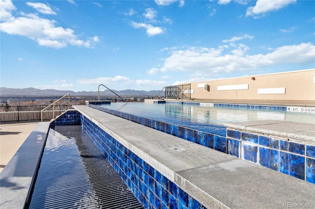 view of pool with a mountain view