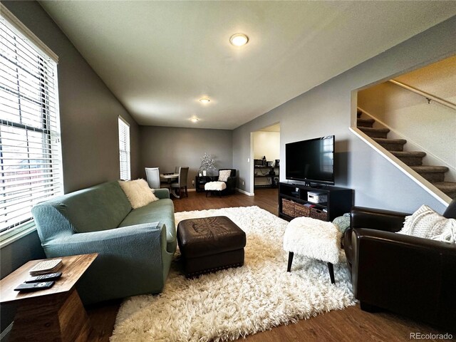 10753 Routt Ct, Broomfield, CO 80021 - living area with baseboards, wood finished floors, and stairs