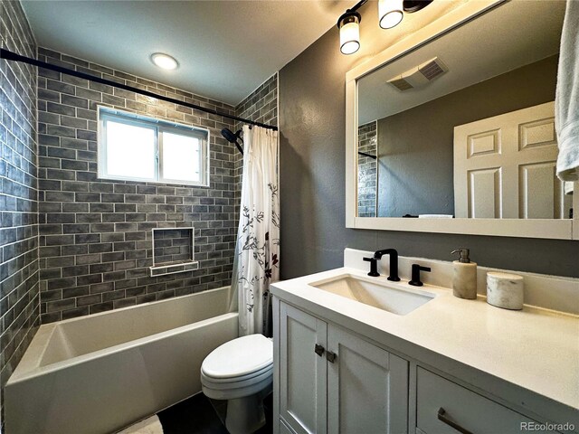 10753 Routt Ct, Broomfield, CO 80021 - bathroom featuring shower / bath combo with shower curtain, visible vents, vanity, and toilet