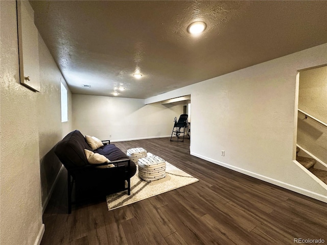 10753 Routt Ct, Broomfield, CO 80021 - living area featuring baseboards, wood finished floors, a textured ceiling, and stairs