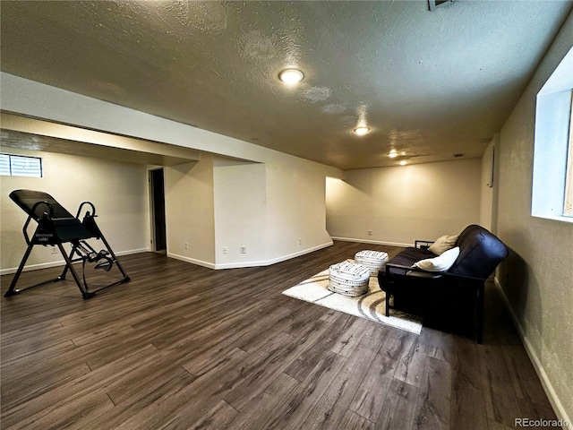 10753 Routt Ct, Broomfield, CO 80021 - below grade area with a textured ceiling and dark wood-style floors