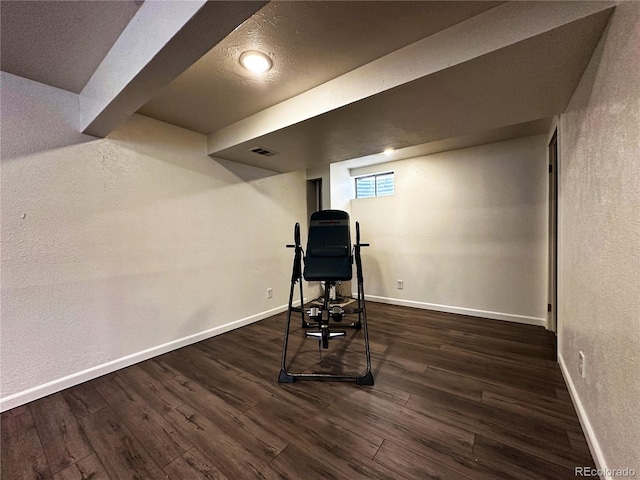 10753 Routt Ct, Broomfield, CO 80021 - exercise area with visible vents, a textured wall, baseboards, and wood finished floors