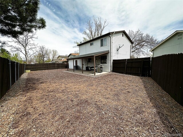 10753 Routt Ct, Broomfield, CO 80021 - back of house with a patio area and a fenced backyard