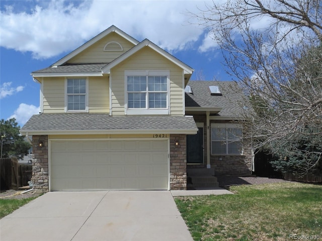 view of front of house featuring a shingled roof, driveway, and a garage