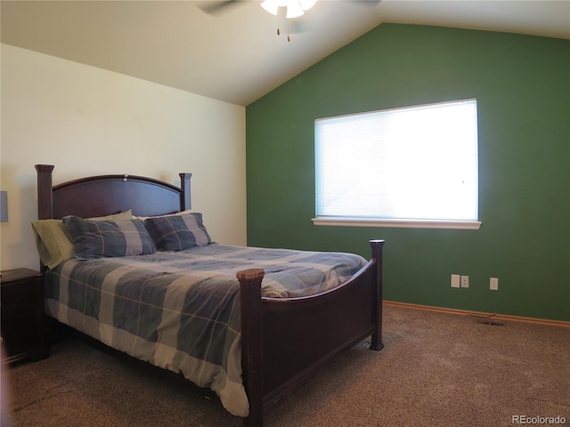 bedroom featuring lofted ceiling, baseboards, a ceiling fan, and carpet flooring