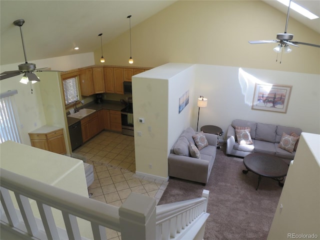 living area featuring light colored carpet, a ceiling fan, high vaulted ceiling, and light tile patterned floors