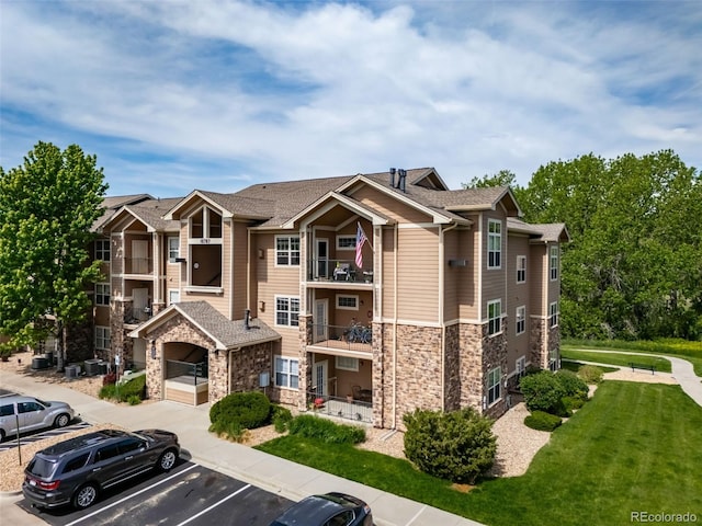 10787 Twenty Mile Rd Unit 205, Parker, CO 80134 - view of property featuring uncovered parking