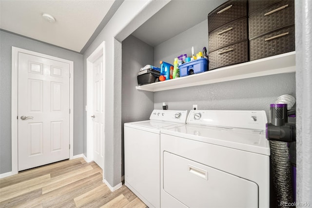 10787 Twenty Mile Rd Unit 205, Parker, CO 80134 - washroom with independent washer and dryer, light wood-style floors, and baseboards