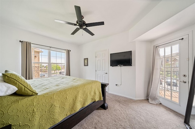 10787 Twenty Mile Rd Unit 205, Parker, CO 80134 - carpeted bedroom with access to outside, multiple windows, baseboards, and a ceiling fan