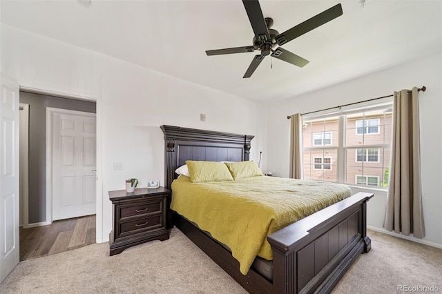 10787 Twenty Mile Rd Unit 205, Parker, CO 80134 - bedroom featuring light colored carpet, a ceiling fan, and baseboards