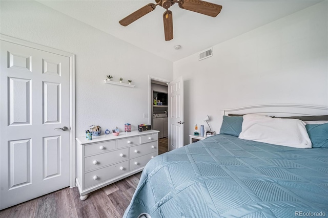 10787 Twenty Mile Rd Unit 205, Parker, CO 80134 - bedroom featuring wood finished floors, washer / clothes dryer, and ceiling fan