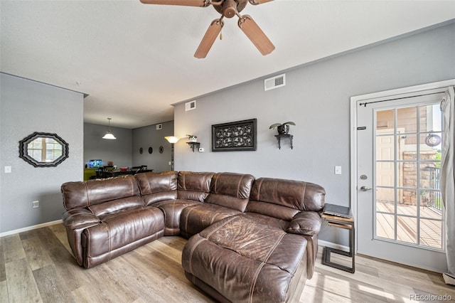10787 Twenty Mile Rd Unit 205, Parker, CO 80134 - living room featuring light wood finished floors, a ceiling fan, and baseboards