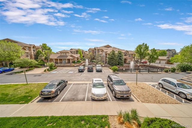 10787 Twenty Mile Rd Unit 205, Parker, CO 80134 - view of asphalt street featuring a residential view, curbs, and sidewalks