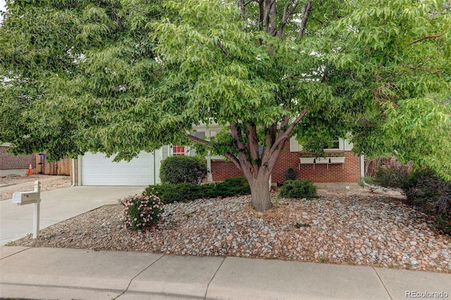10883 Otis Cir, Westminster, CO 80020 - obstructed view of property featuring brick siding and driveway