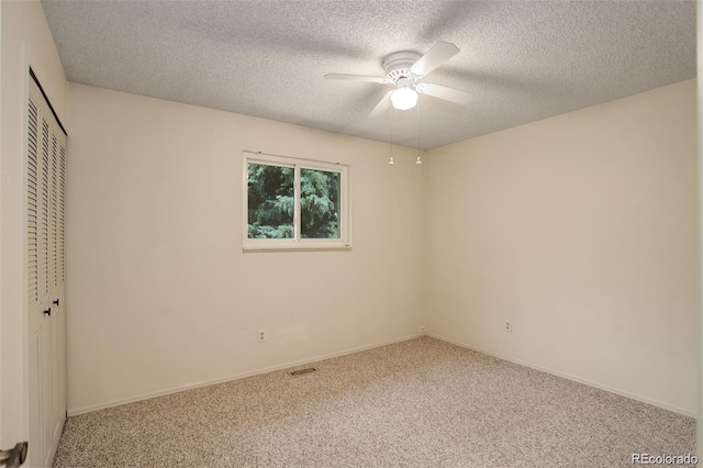 10883 Otis Cir, Westminster, CO 80020 - unfurnished bedroom featuring carpet flooring, a closet, a textured ceiling, and ceiling fan
