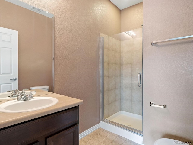 bathroom with vanity, an enclosed shower, and toilet