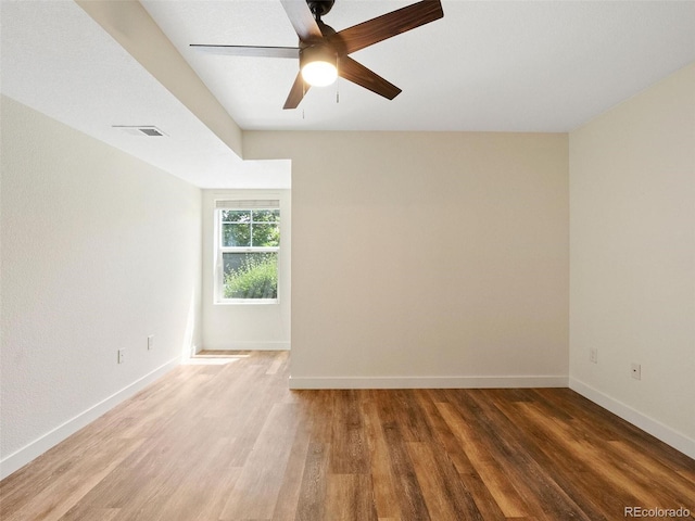 unfurnished room featuring ceiling fan and wood-type flooring