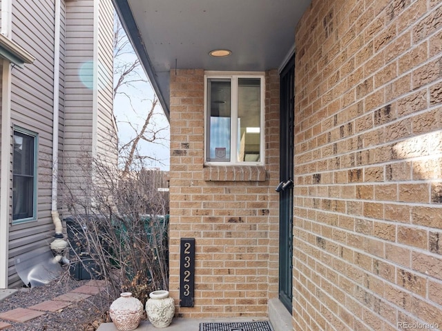 property entrance with brick siding