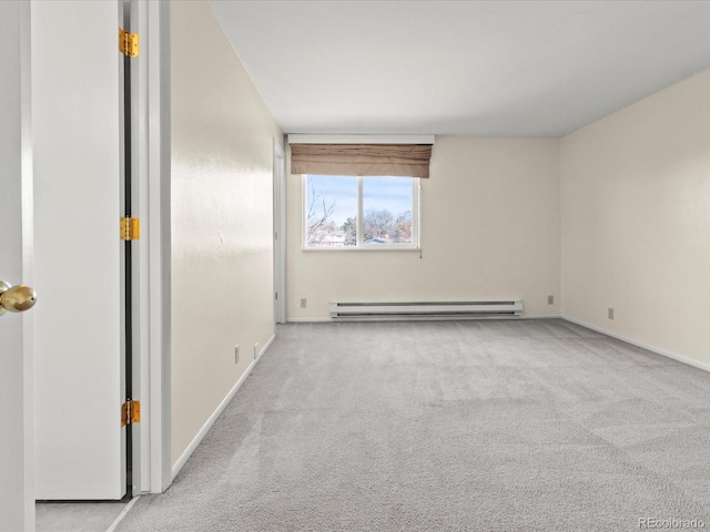 unfurnished room with a baseboard heating unit, light carpet, and baseboards