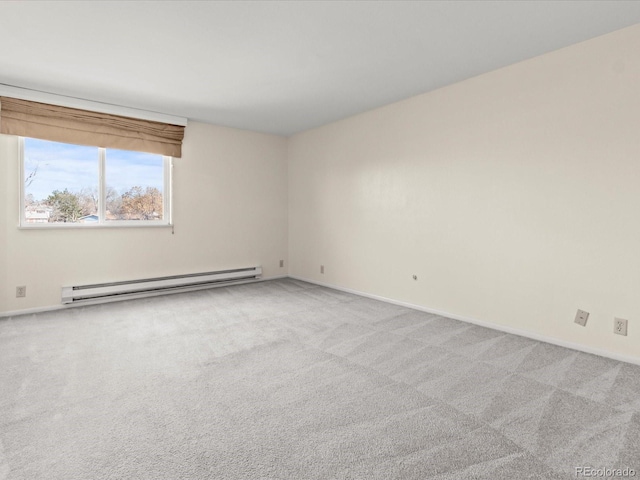 spare room featuring baseboards, a baseboard radiator, and light colored carpet