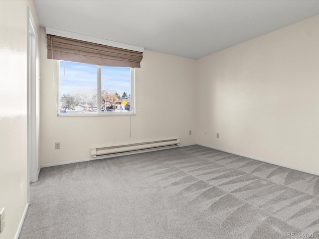 unfurnished room featuring light carpet, a baseboard radiator, and baseboards